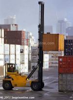 ID 1858 PORT OF AUCKLAND, NZ - A mast-lift truck working among container stacks, Axis Fergusson Container Terminal.